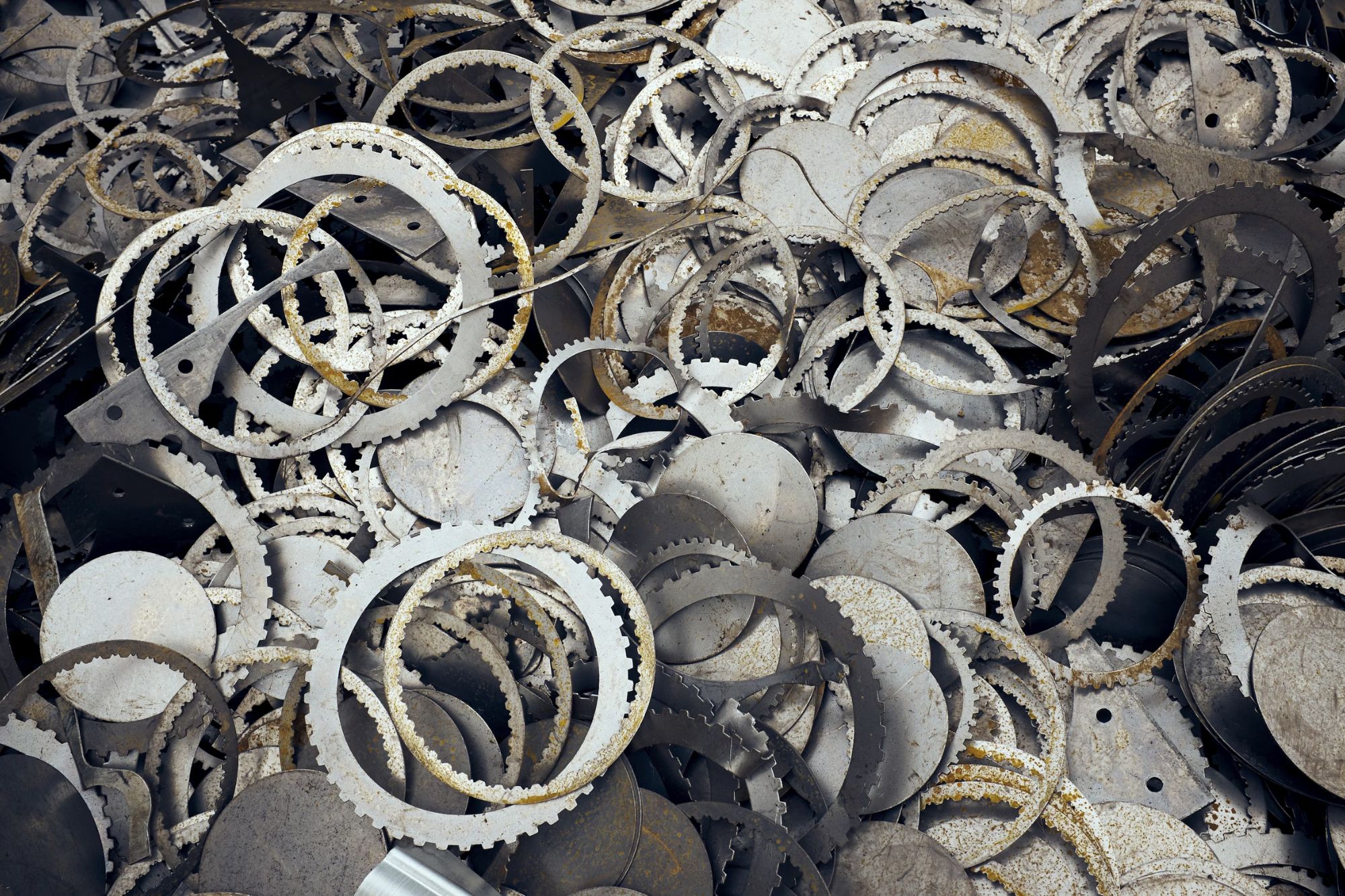 Various metal parts stacked together, showcasing the bulk junk removal service available in Austin, TX.