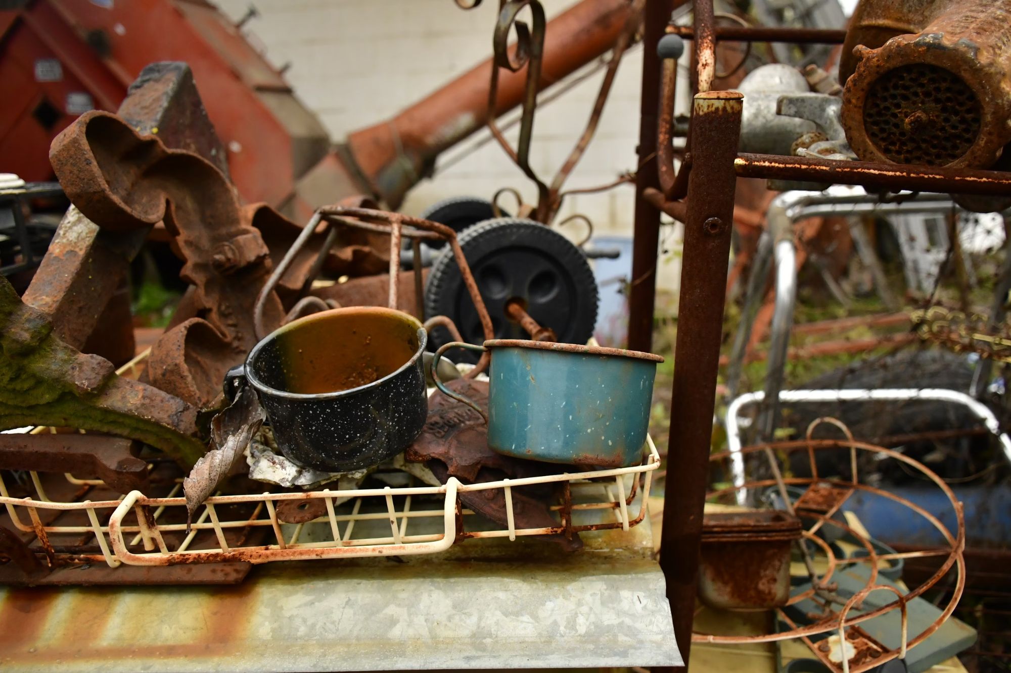 Rusty metal and assorted items arranged in a basket, illustrating the junk removal service offered in Austin, TX.